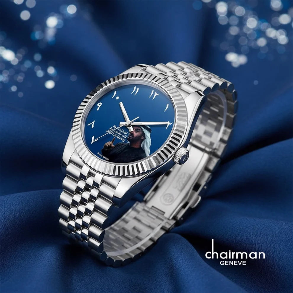 blue | Silver watch with blue dial on a blue fabric background, featuring the brand 'chairman Geneve'.