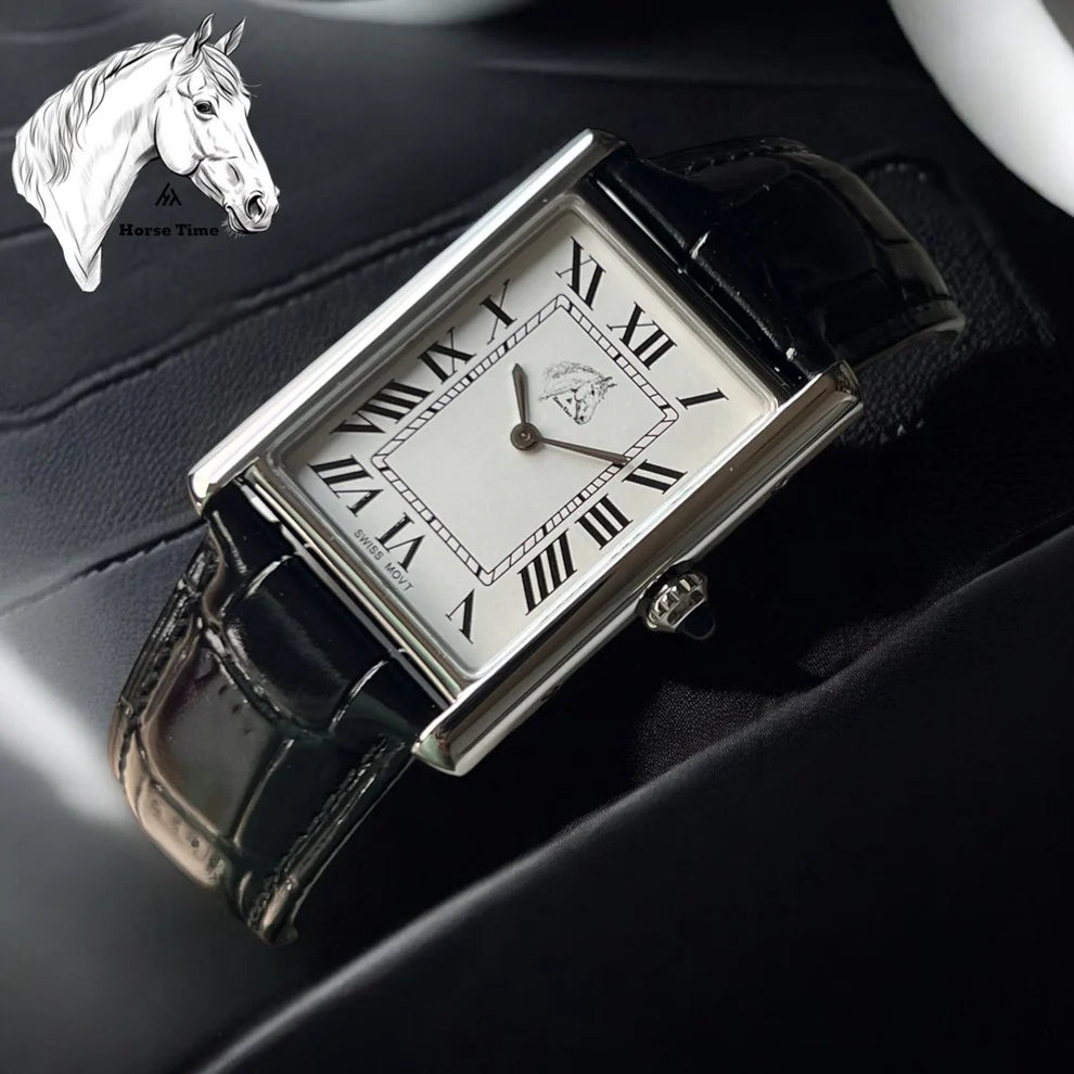 Black | Rectangular watch with black strap on a dark surface, featuring Roman numerals.
Salam Luxury