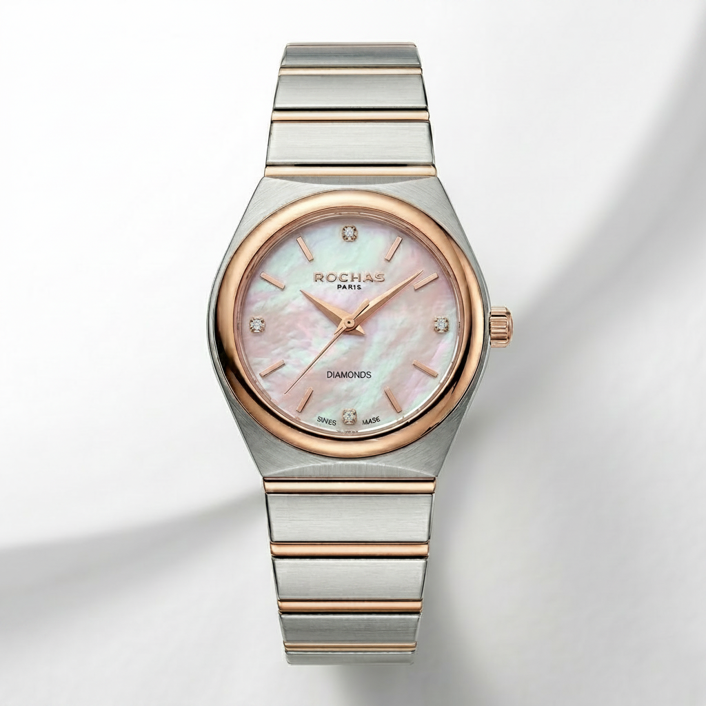 Silver and rose gold watch with a pink face on a light gray background
Salam Luxury