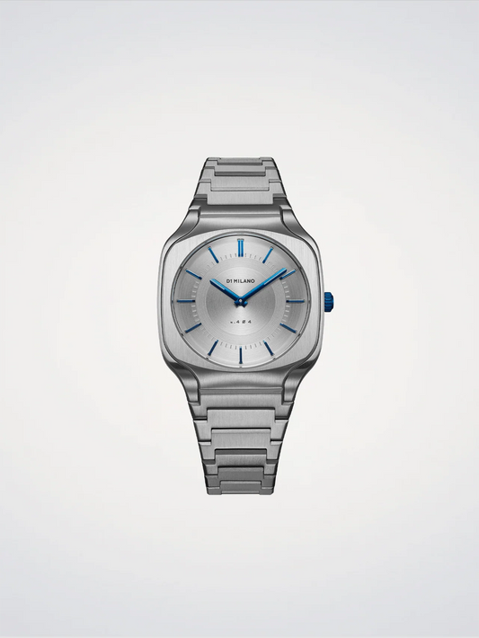 Silver watch with blue accents on a light gray background
Salam Luxury