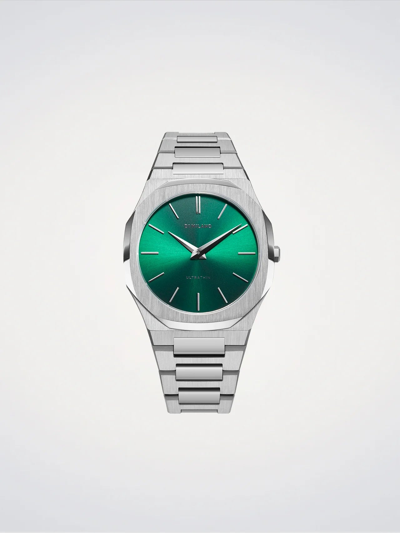 Silver watch with a green face on a light gray background
Salam Luxury