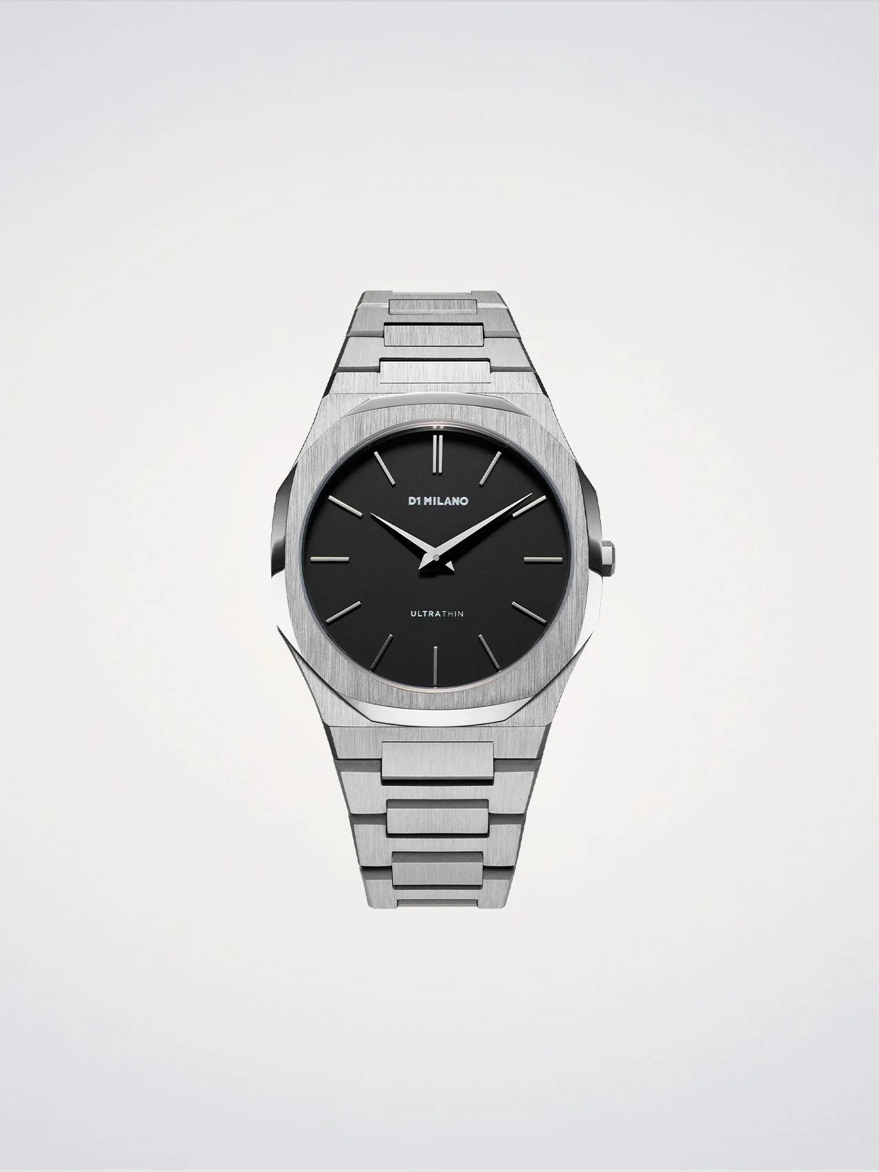 Silver watch with black dial on a light gray background
Salam Luxury