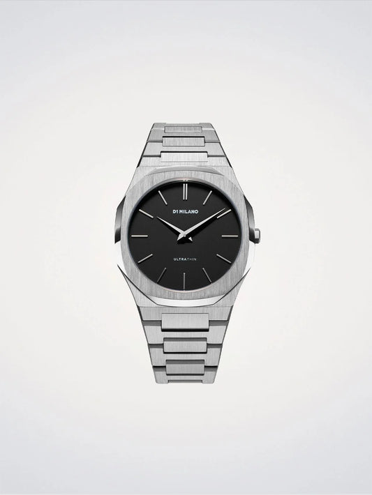 Silver watch with black dial on a light gray background
Salam Luxury