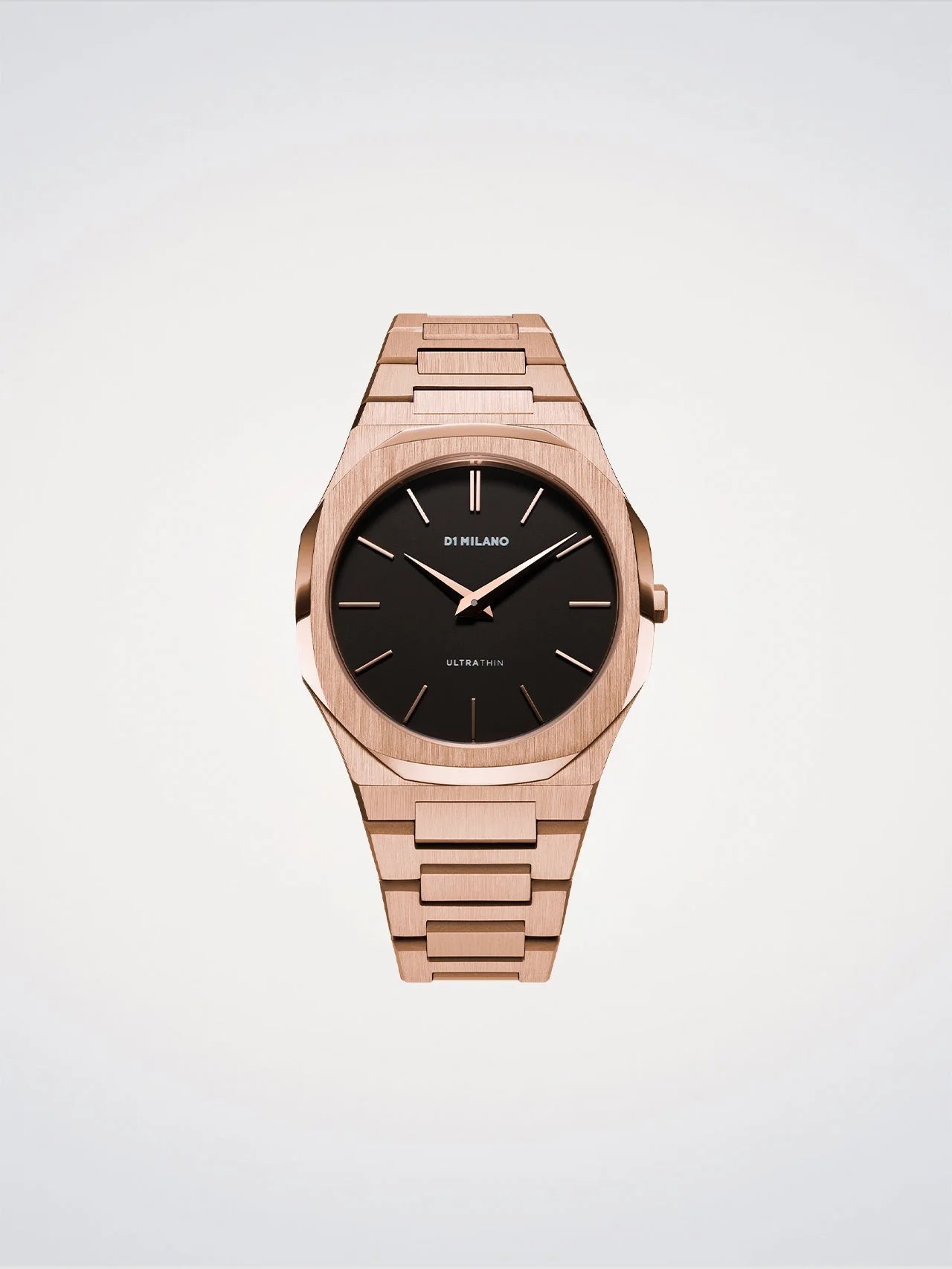 Rose gold watch with black dial on a light gray background
Salam Luxury