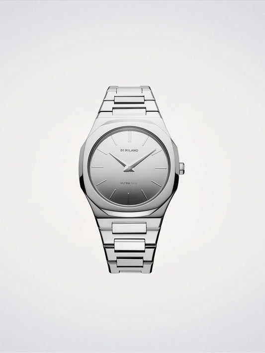 Silver watch with a metallic band on a light gray background
Salam Luxury