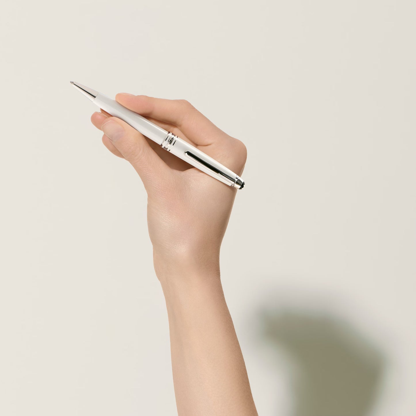 Professional premium writing experience with the Montblanc white luxury ballpoint pen held in hand, curated by Salam Luxury.