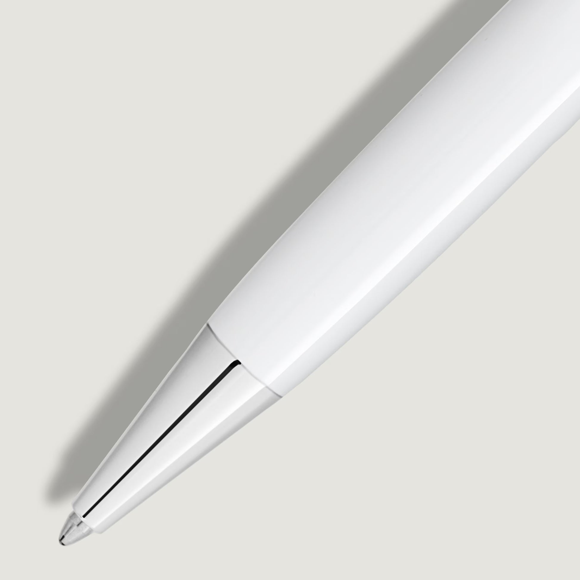 Detailed close-up of the polished platinum-plated tip and sleek white barrel of the luxury pen from Salam Luxury.