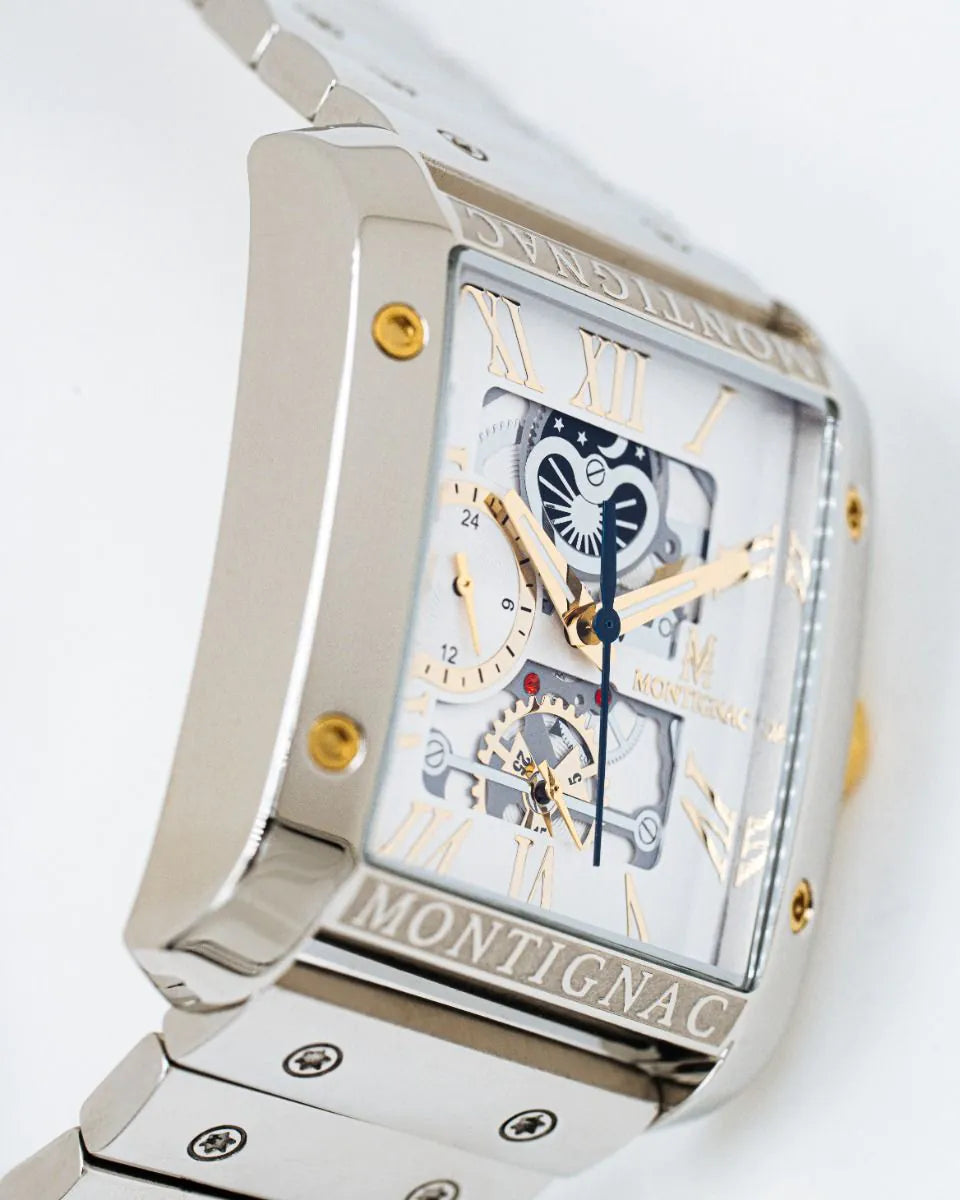 Silver | Angle view of Salam Luxury silver rectangular skeleton watch showing gold screws and engraved bezel detail.