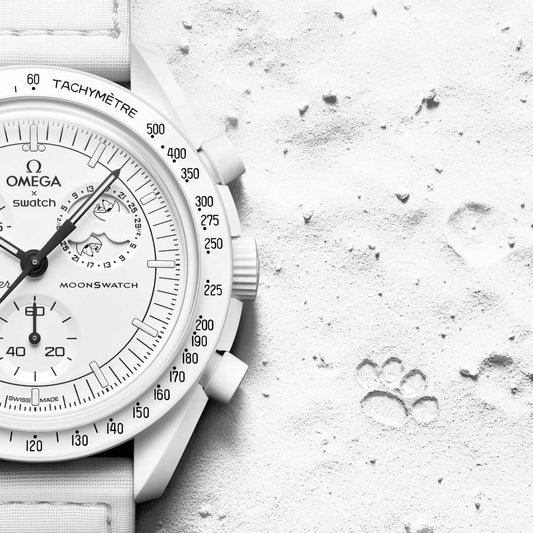 White | Omega x Swatch Snoopy White watch on white surface with paw prints - SALAM LUXURY
