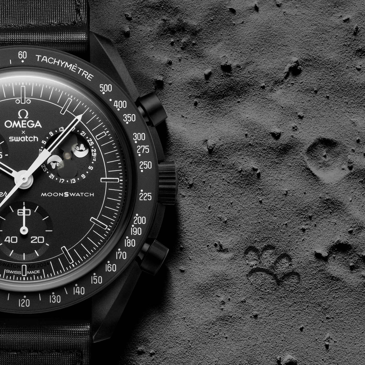 Black | Omega x Swatch Snoopy Black watch on grey moon-like surface - SALAM LUXURY