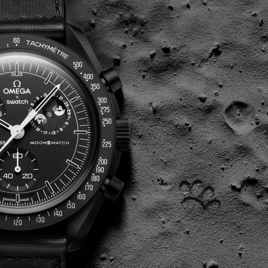 Black | Omega x Swatch Snoopy Black watch on grey moon-like surface - SALAM LUXURY