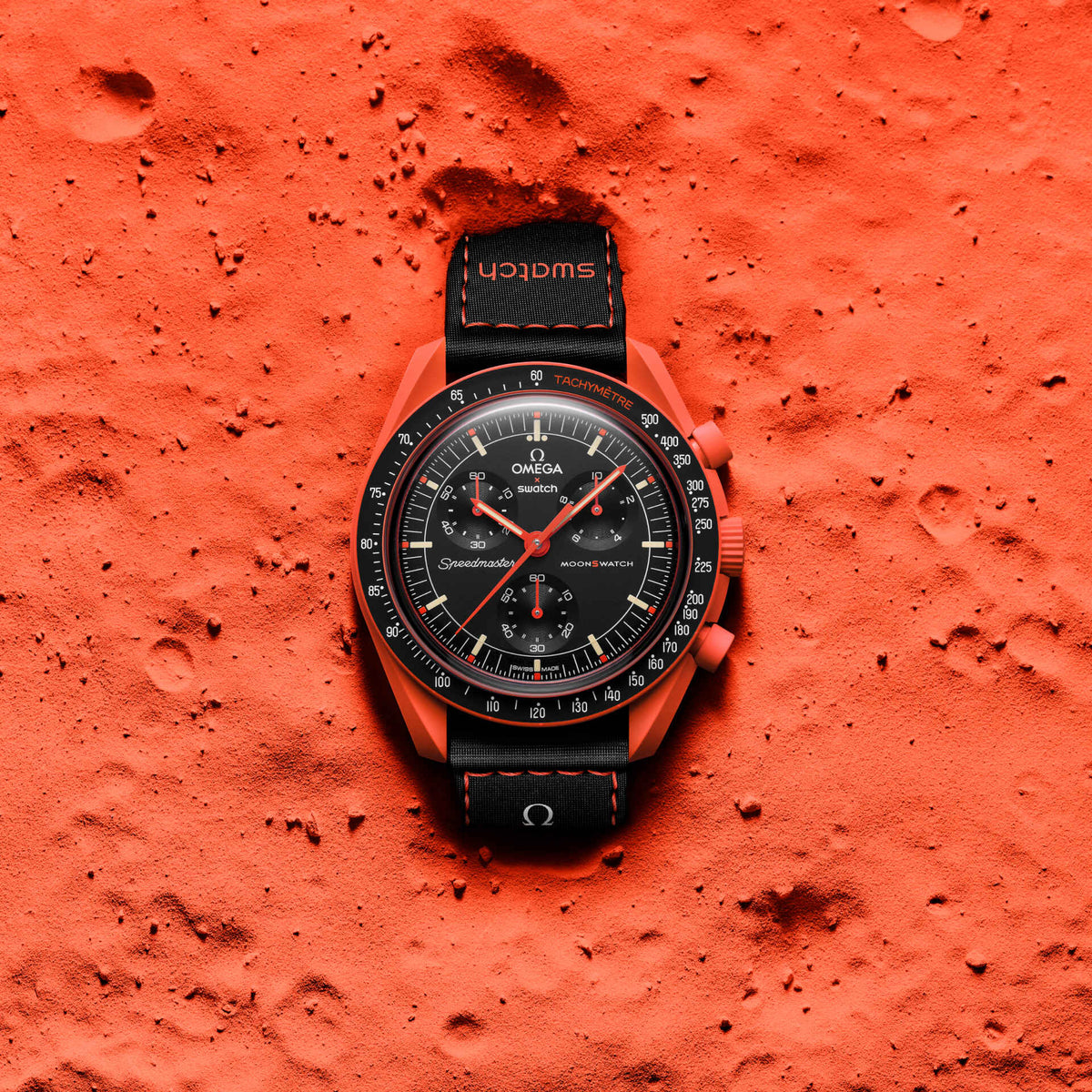 Lava | Omega x Swatch Mission on Earth watch on an orange-red textured surface - SALAM LUXURY