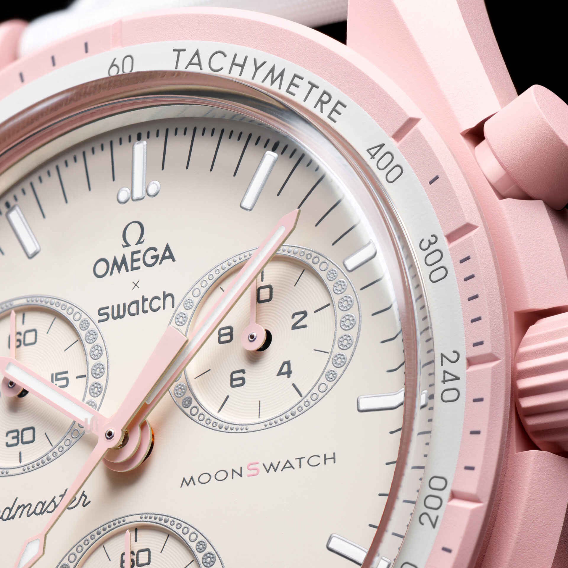 Close-up view of Omega x Swatch Mission to Venus pink dial and tachymeter bezel – Salam Luxury