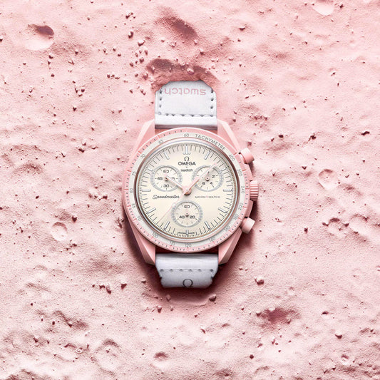Omega x Swatch MoonSwatch Mission to Venus watch on pink surface - Salam Luxury