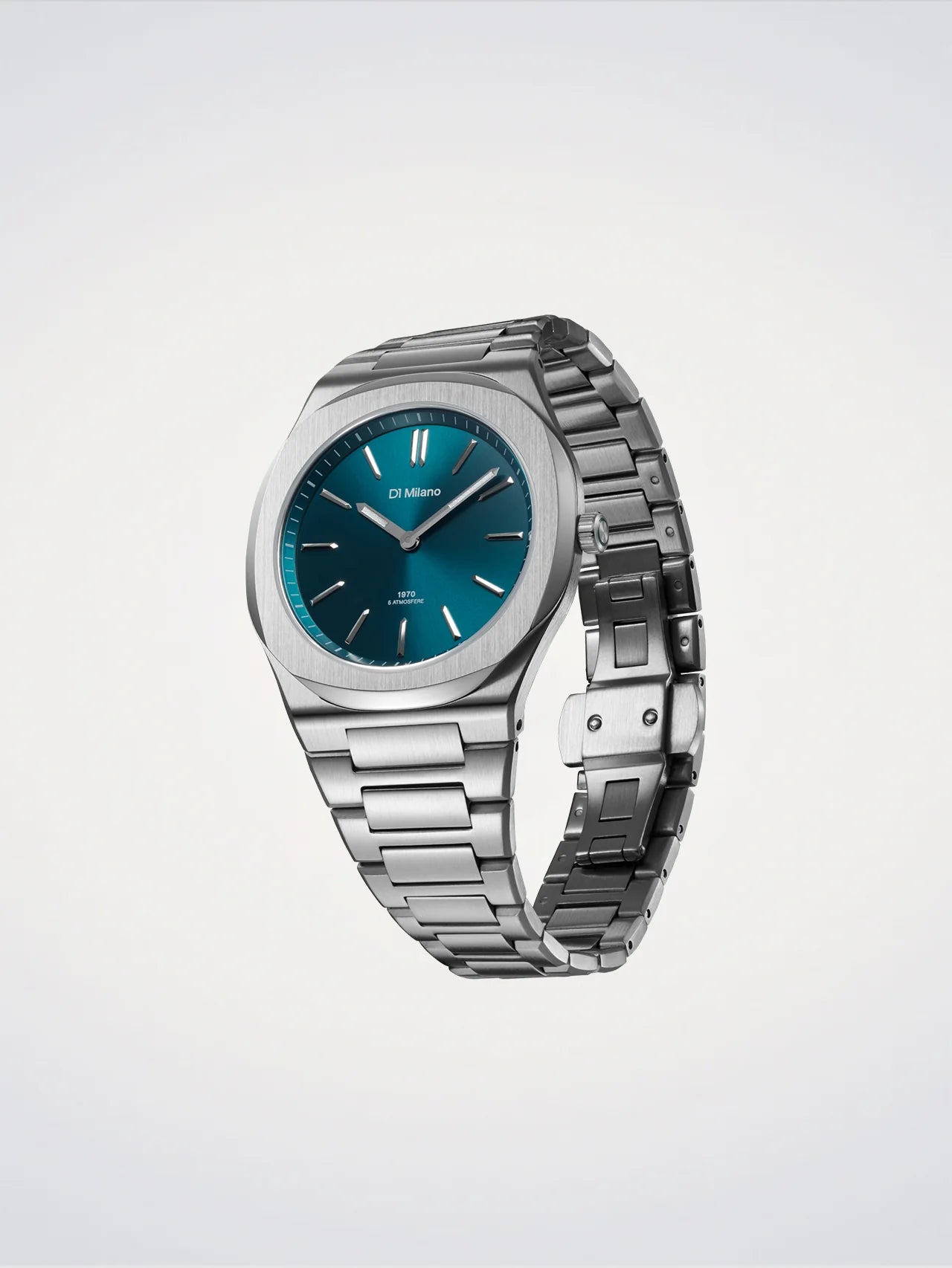 Silver watch with a blue face on a light gray background
Salam Luxury
