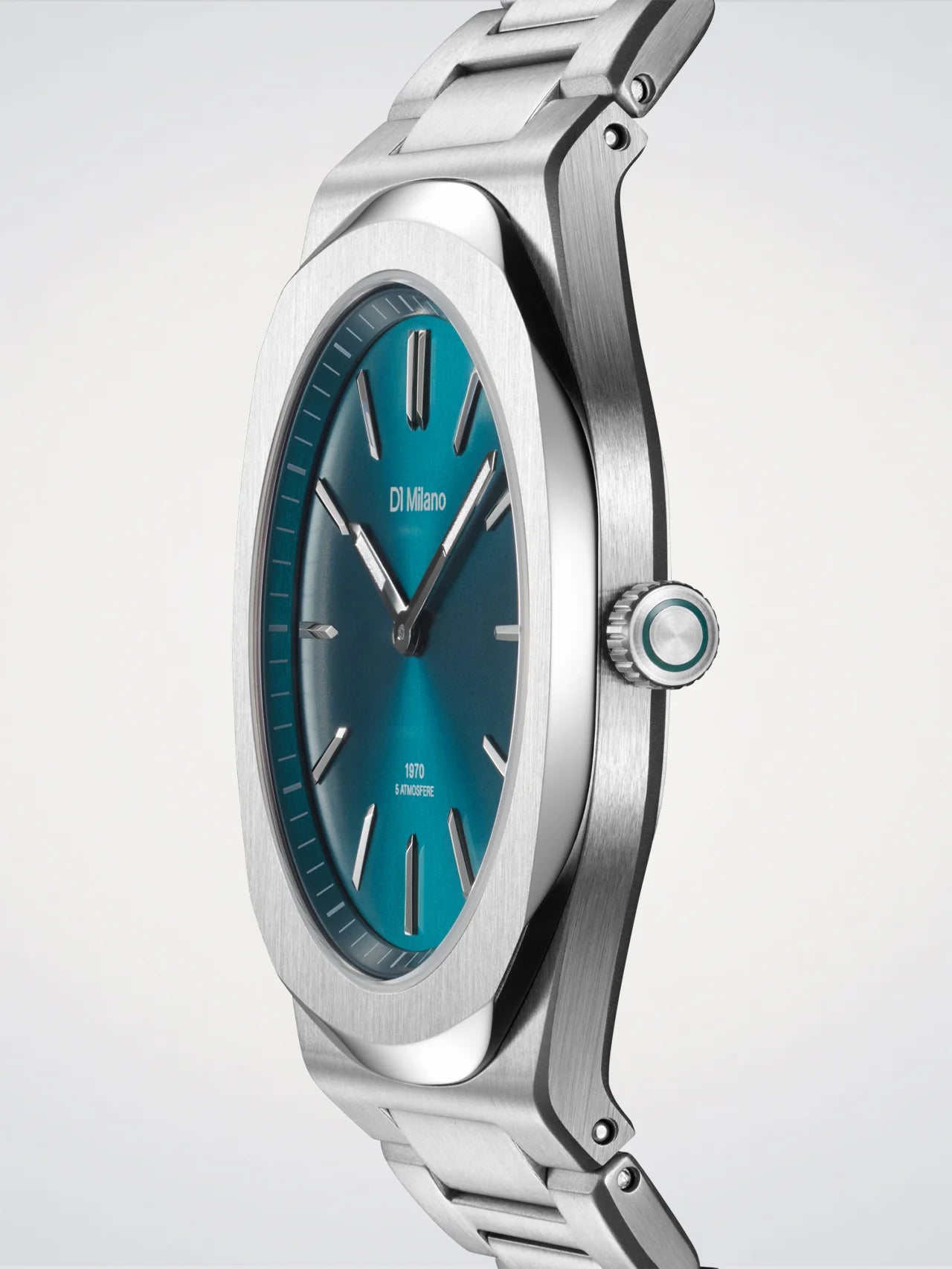 Silver watch with a blue dial on a light gray background
Salam Luxury