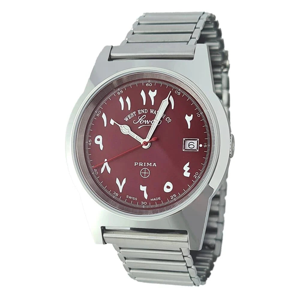 Marooon | Wristwatch with red face and silver metal strap on white background
Salam Luxury UAE
