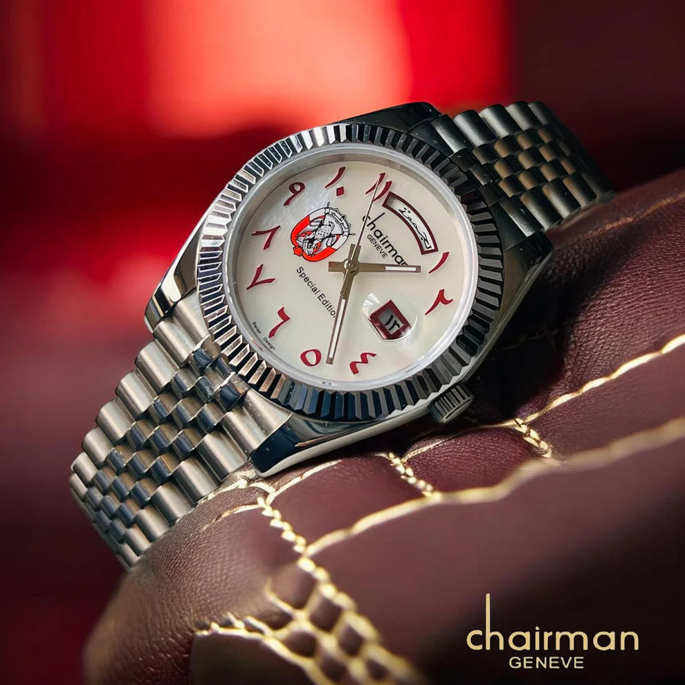 Silver watch with a unique face on a textured surface, brand 'Chairman Geneve' visible
Salam Luxury