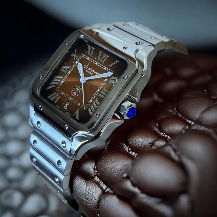 Luxury watch with brown dial and Roman numerals on a textured surface 
Salam Luxury UAE