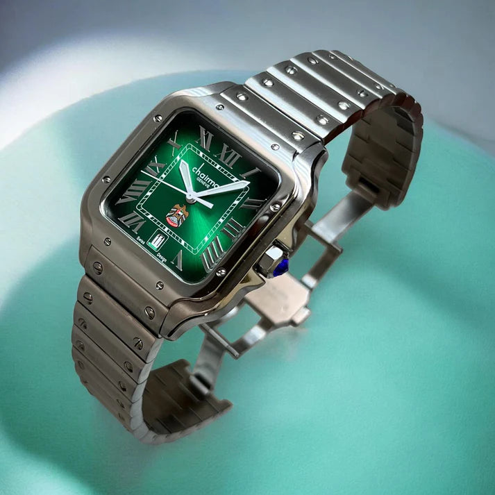 Silver wristwatch with a green face on a light blue background
Salam Luxury UAE