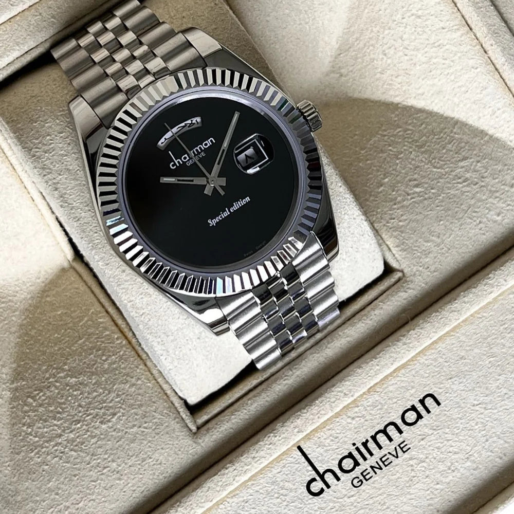 Silver watch with black face on a light brown surface, featuring the 'Chairman' brand.
Salam Luxury UAE