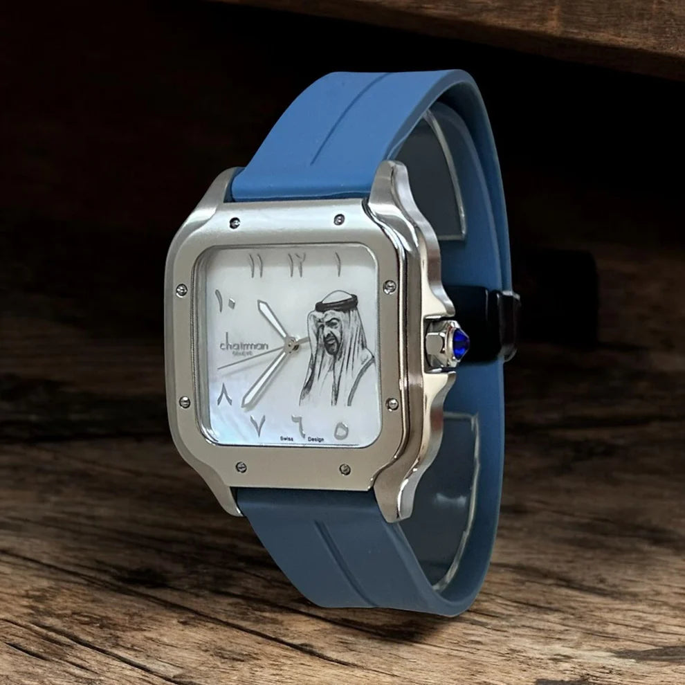Wristwatch with blue strap and silver case on a wooden surface
Chairman Watch Salam Luxury
