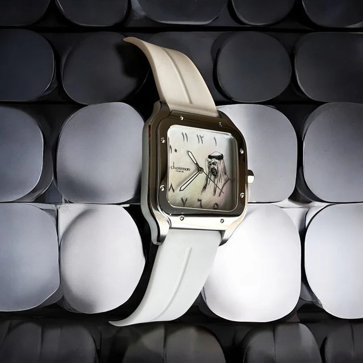 Chairman Watch with a white strap on a textured black and white background
Salam Luxury