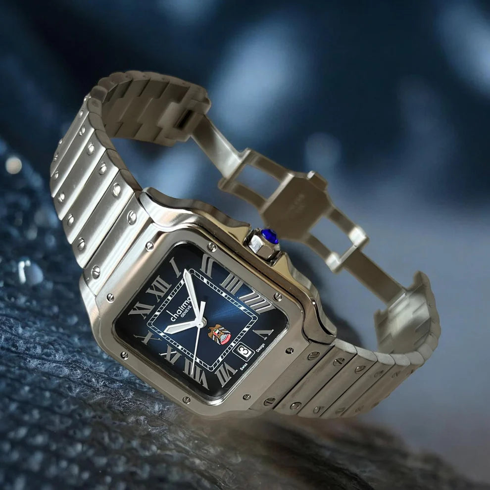Silver watch with a blue face on a textured surface
Salam Luxury UAE