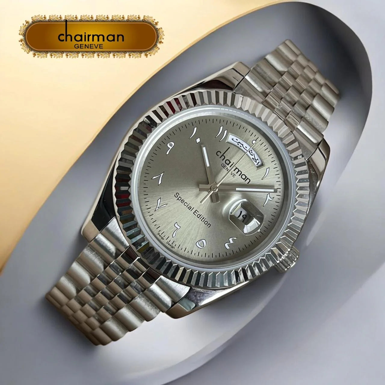 Silver watch with detailed face on a gray and beige background, featuring the Chairman Geneva brand.
available on Salam Luxury UAE