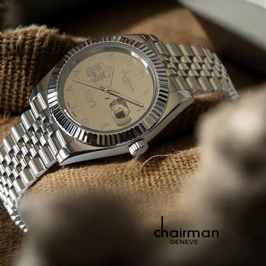 Silver watch with detailed face on a textured surface, brand 'chairman' visible
Salam Luxury