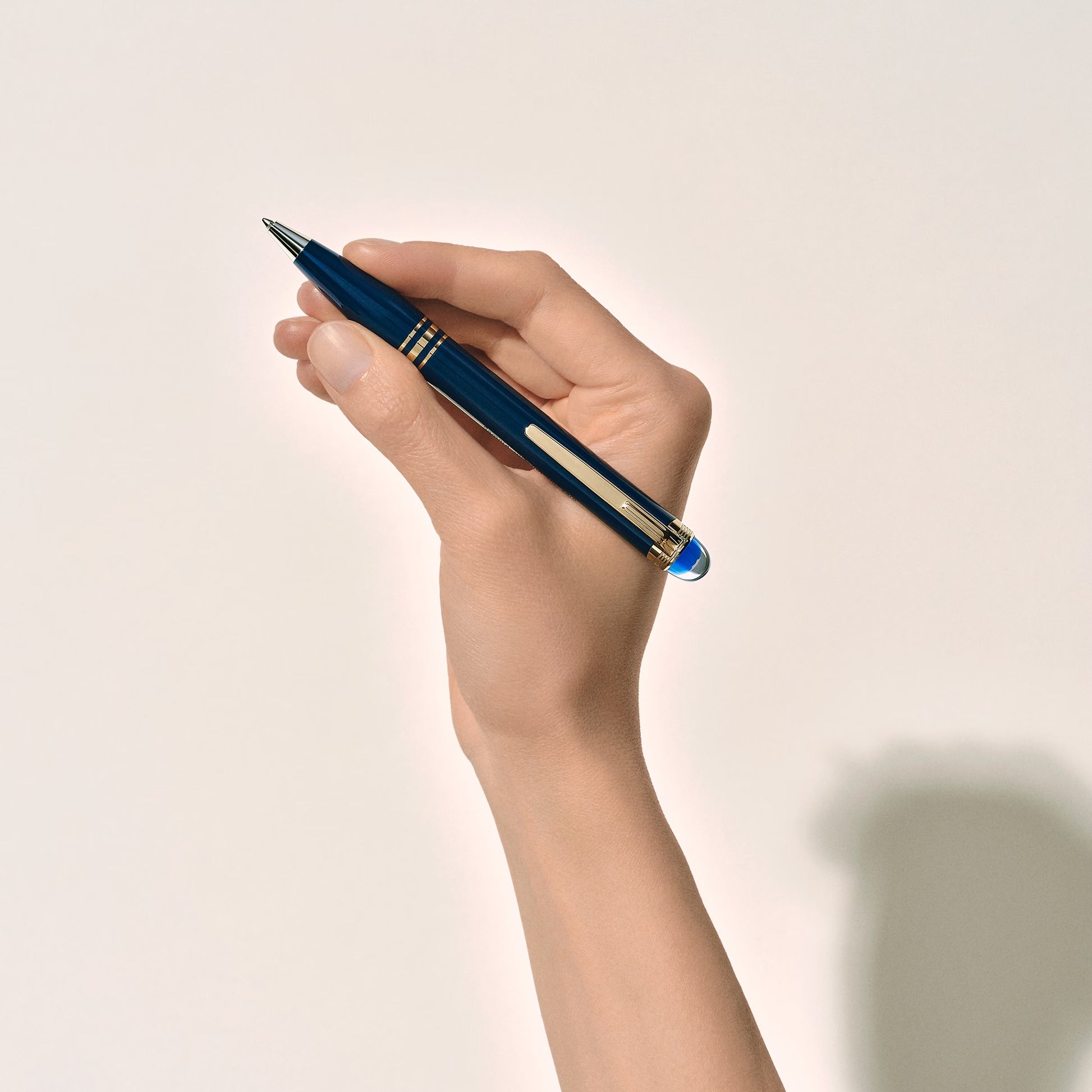 Blue | Hand model holding the luxury blue Montblanc StarWalker Blue Planet ballpoint pen from Salam Luxury.