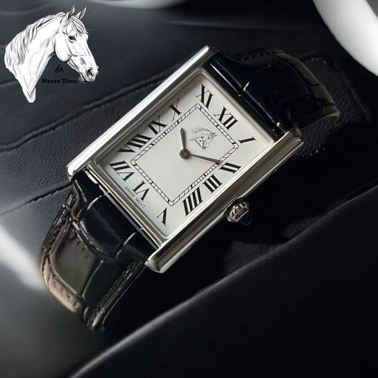 Black | Rectangular watch with black strap on a dark surface, featuring Roman numerals.
Salam Luxury 