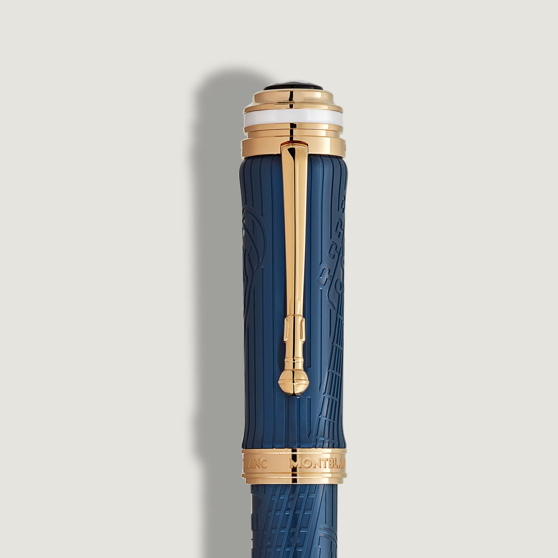 Close-up of the royal blue cap and gold-plated clip on the Montblanc Homage to Queen Victoria special edition pen at Salam Luxury.