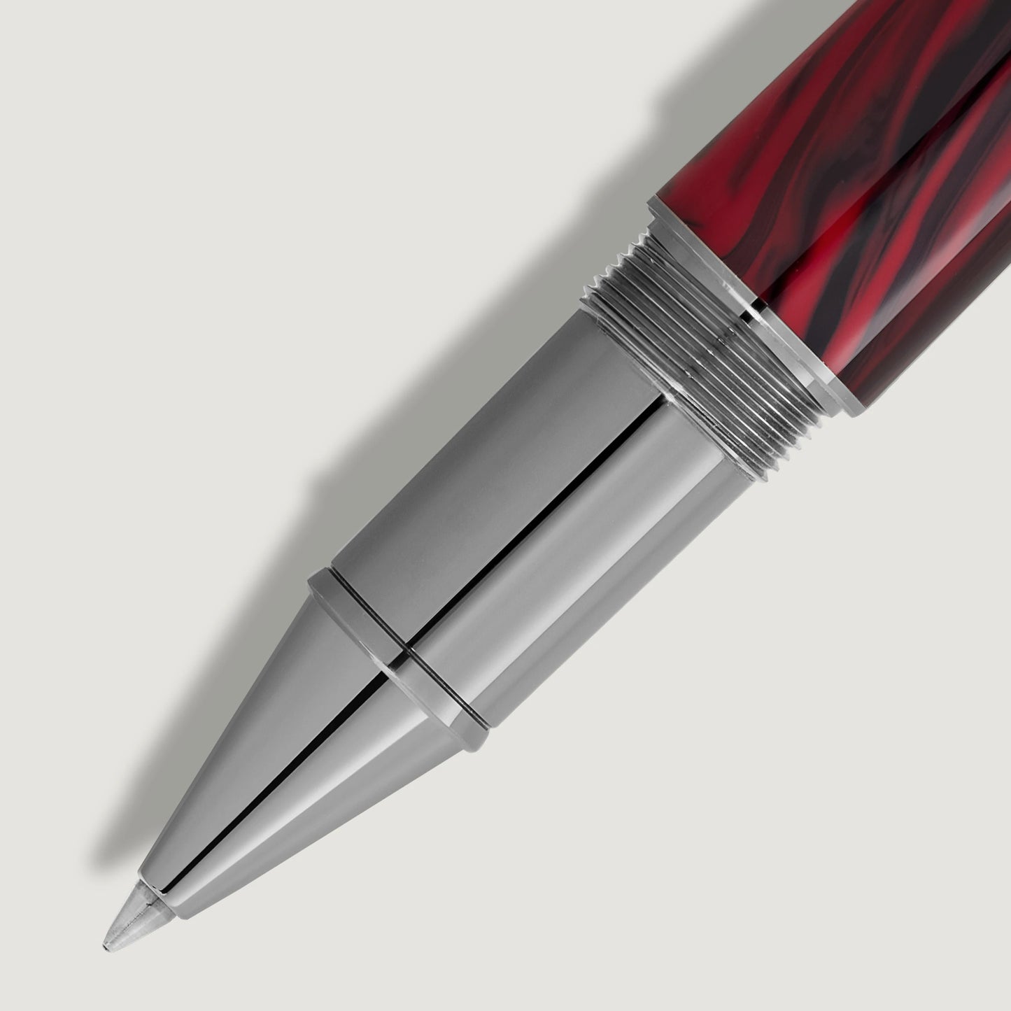 Detailed close-up of the platinum-coated front section and red-black patterned barrel of Bram Stoker rollerball pen from Salam Luxury.