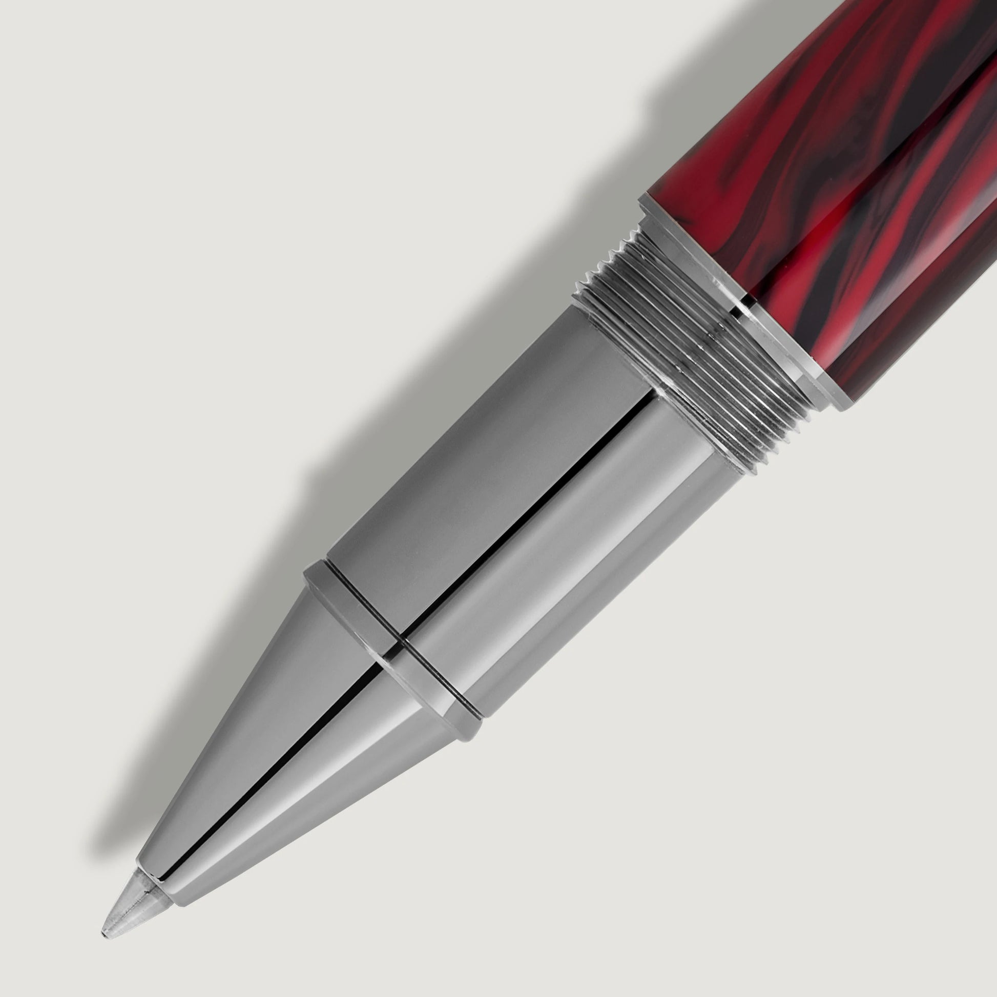 Detailed close-up of the platinum-coated front section and red-black patterned barrel of Bram Stoker rollerball pen from Salam Luxury.