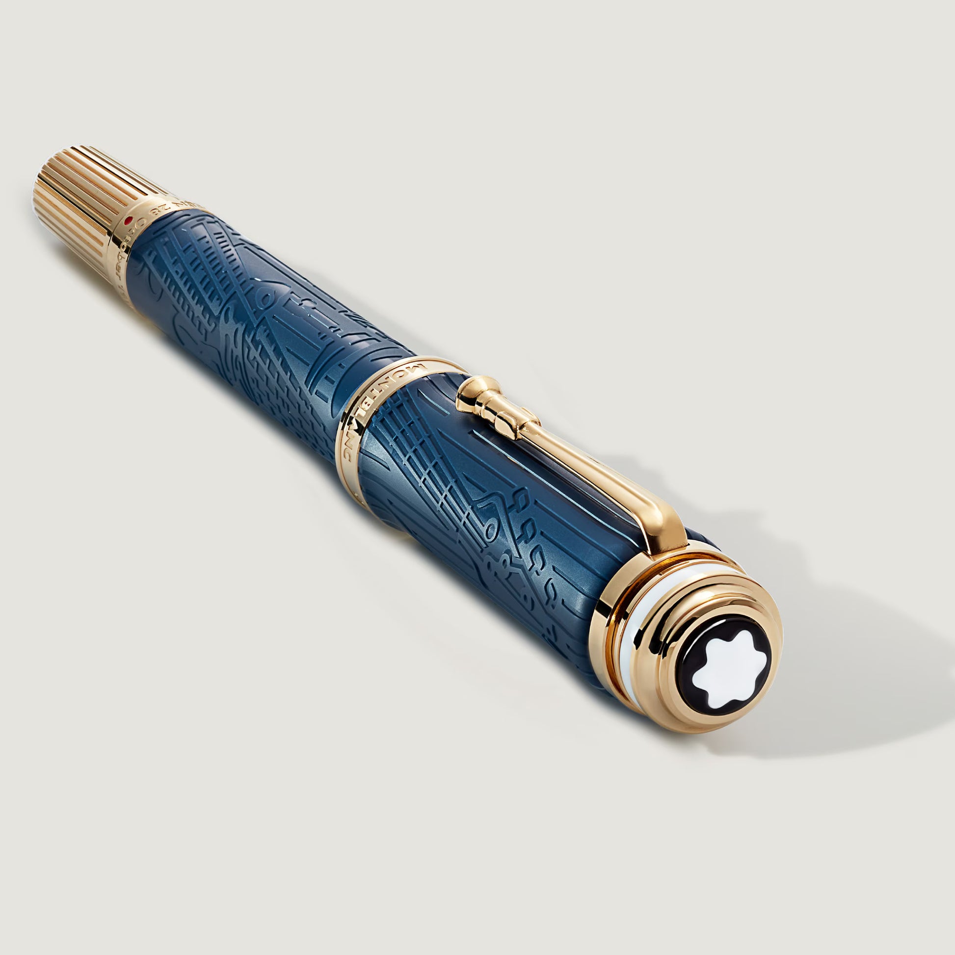 Angled shot of the luxury Montblanc Queen Victoria pen showcasing the signature white emblem on the cap top, from Salam Luxury.