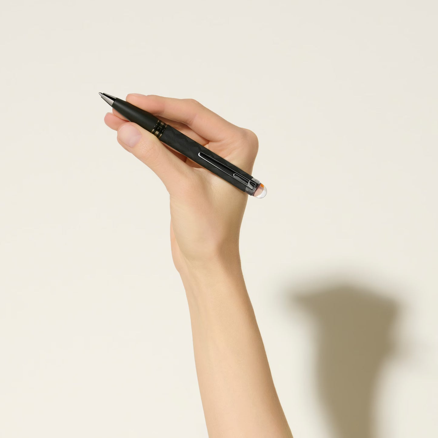 A person holding the StarWalker Extreme luxury black ballpoint pen in hand, demonstrating its premium grip and classic writing style - Salam Luxury.