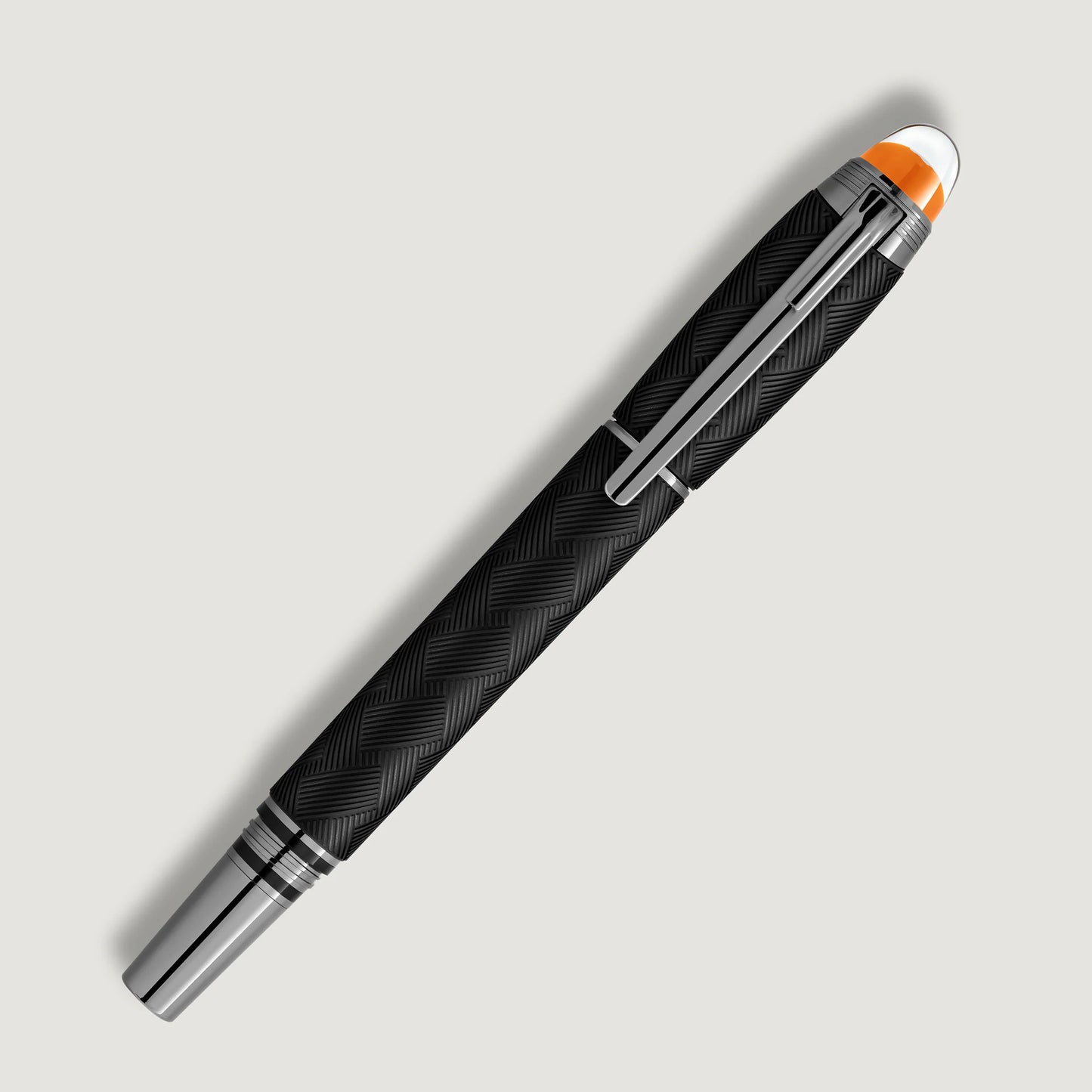 Full diagonal shot of the elegant black and silver luxury writing instrument with cap on, featured by Salam Luxury.