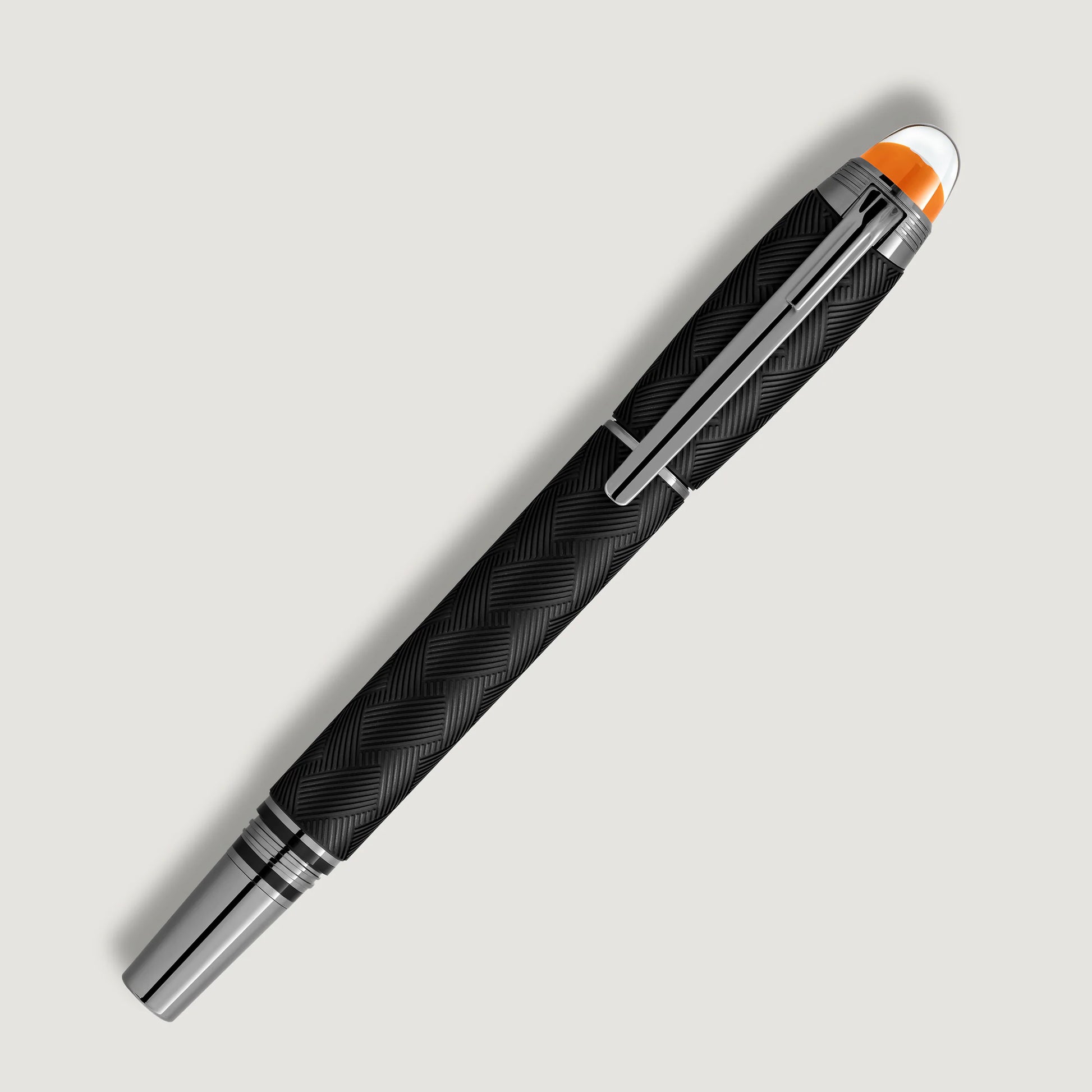 Full diagonal shot of the elegant black and silver luxury writing instrument with cap on, featured by Salam Luxury.