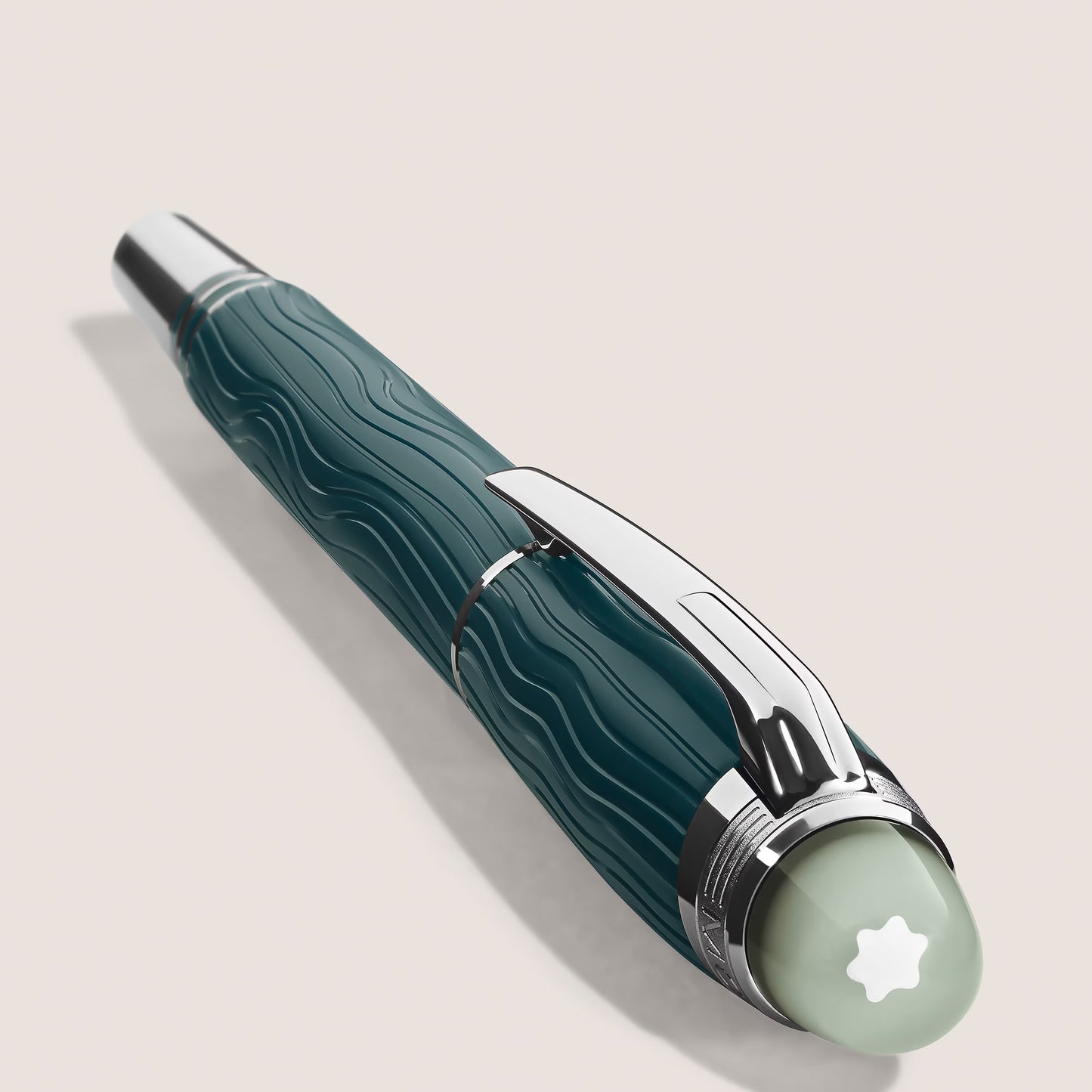 Close-up of the wave-pattern cap and platinum-coated clip of the Montblanc StarWalker PolarGreen pen at Salam Luxury.