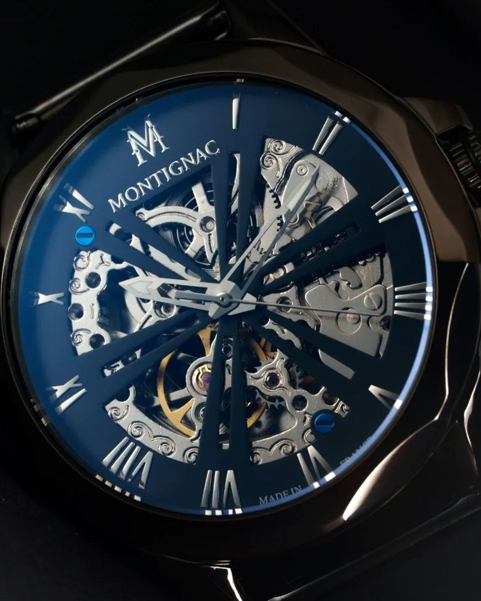 Montignac watch with blue face and visible mechanical components on a dark background