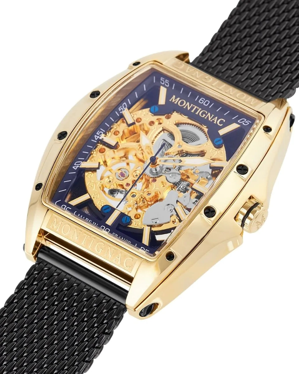 Gold watch with black mesh strap and visible mechanical components on a white background