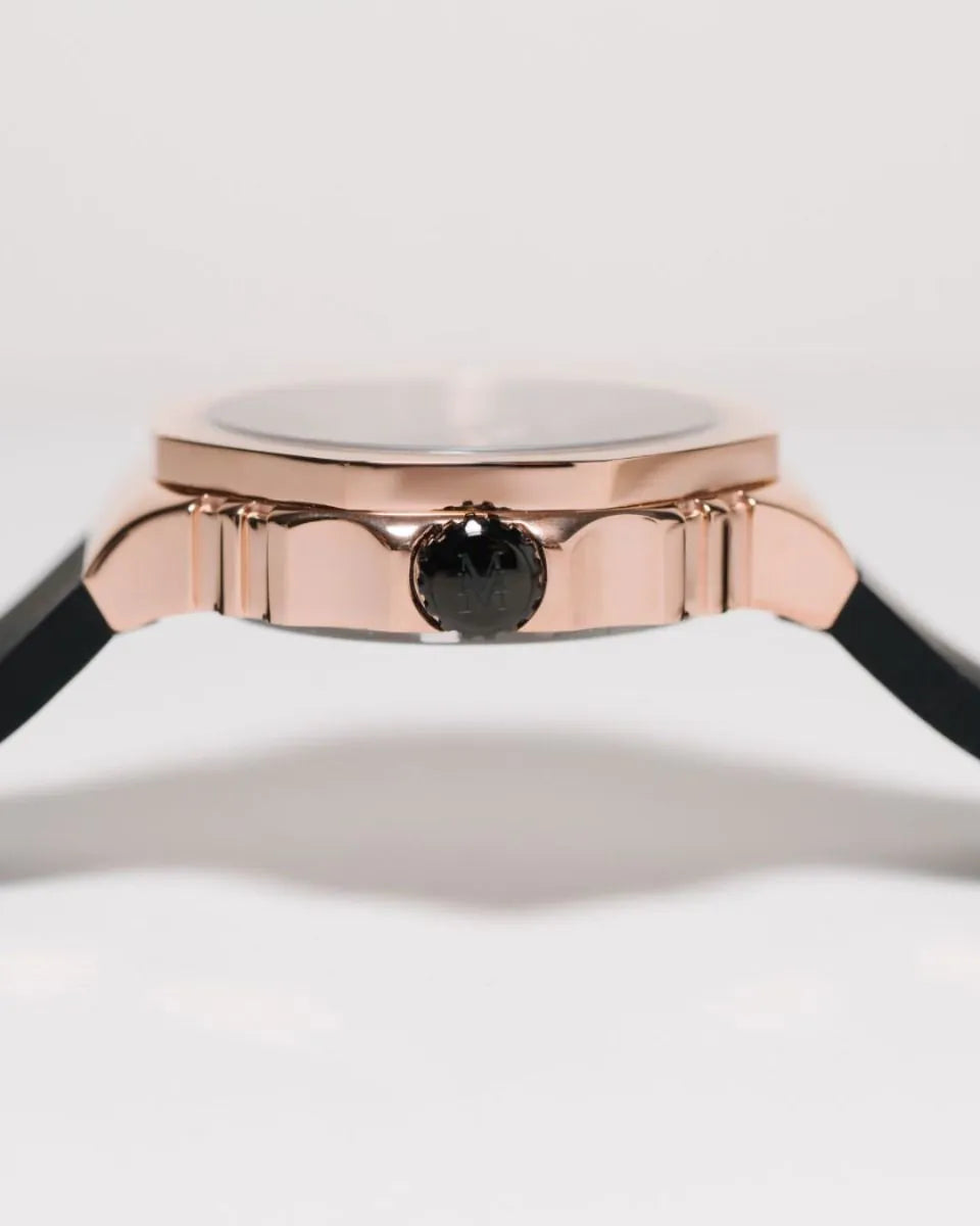 Rose gold watch with black face on a white background