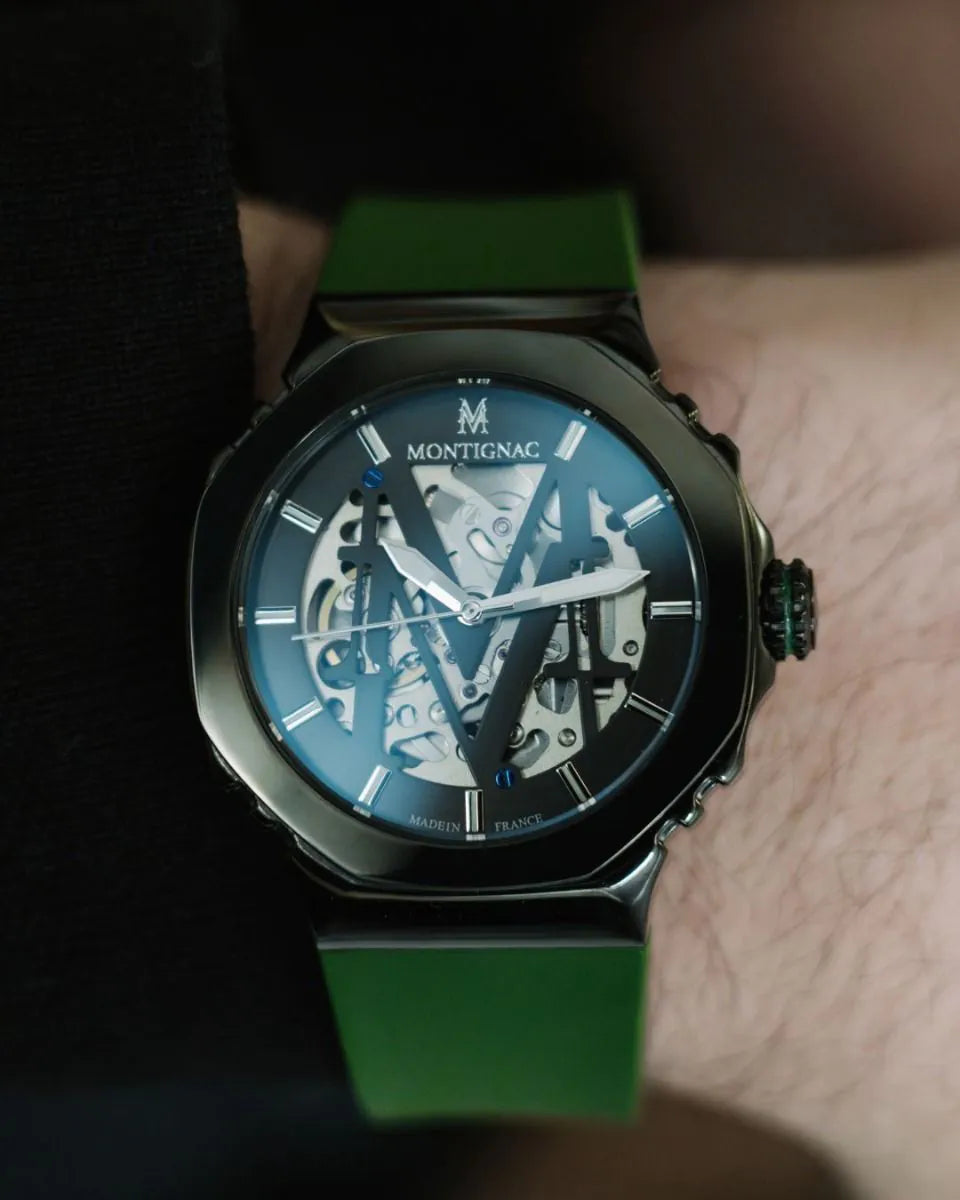 Watch with a green strap and blue face on a wrist, brand 'Montignac' visible