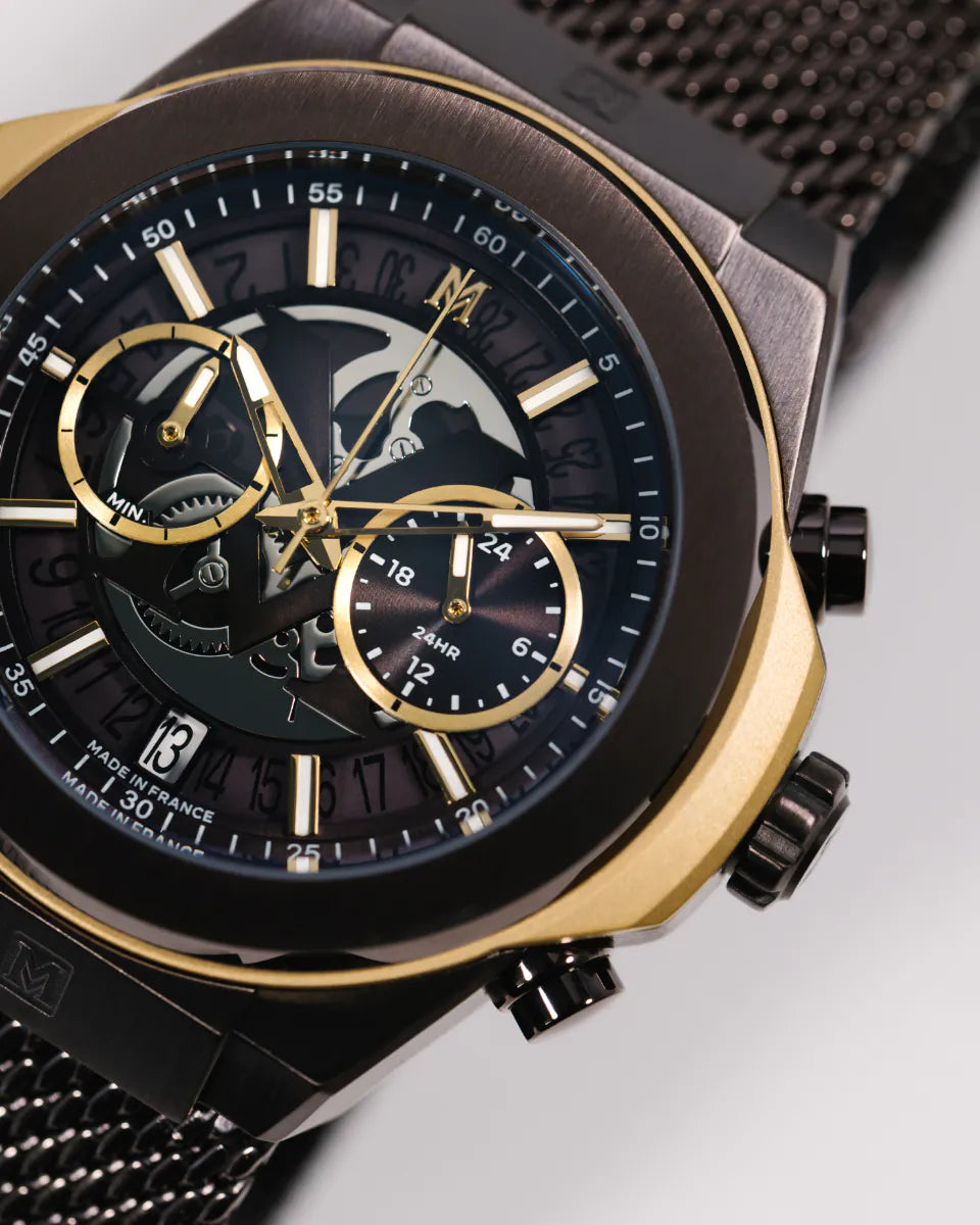 Brown | Luxury watch with black and gold face on a light gray background
Salam Luxury UAE