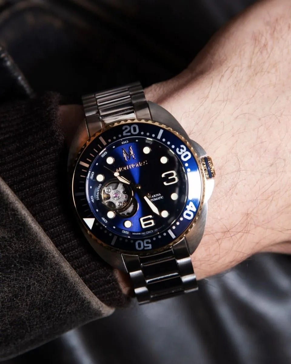 Salam Luxury watch with blue dial and rose gold accents on a wrist against a dark background