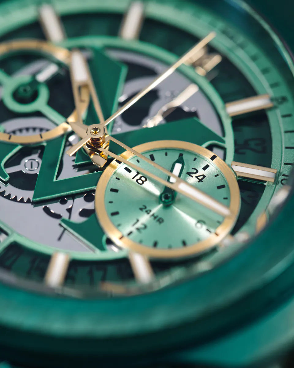 Green | Close-up of a green mechanical watch with gold accents
Salam Luxury 