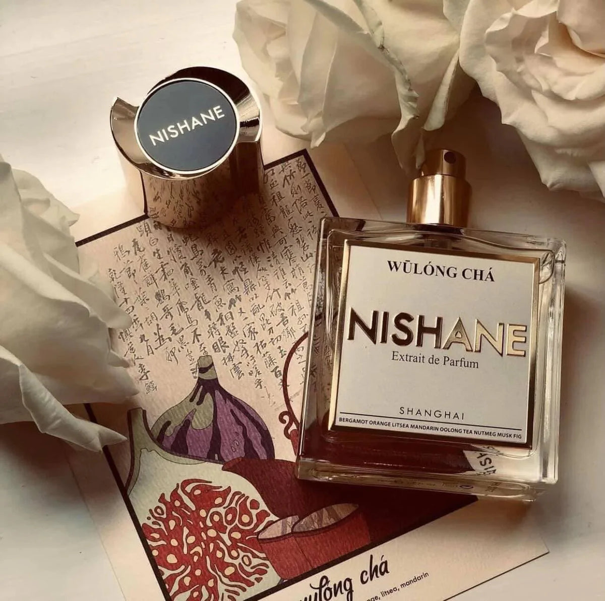 Nishane Wūlong Chá gift set bottle displayed with decorative elements and fresh notes at Salam Luxury
