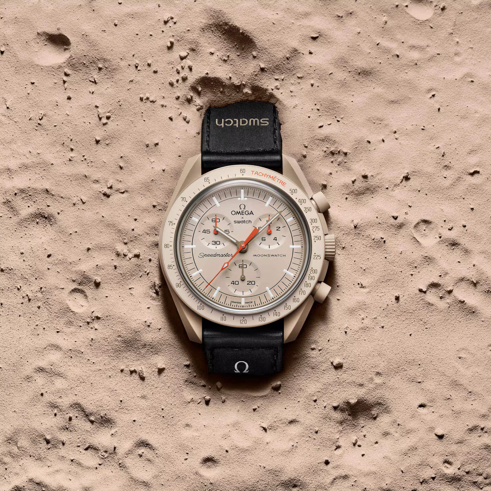 Omega x Swatch MoonSwatch Mission to Jupiter watch on sandy surface - Salam Luxury