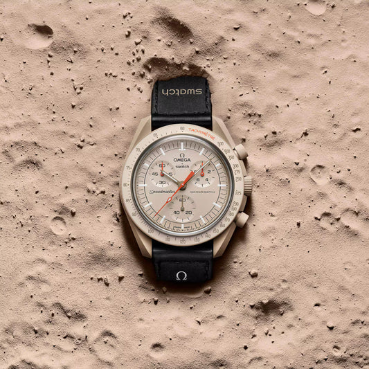 Omega x Swatch MoonSwatch Mission to Jupiter watch on sandy surface - Salam Luxury